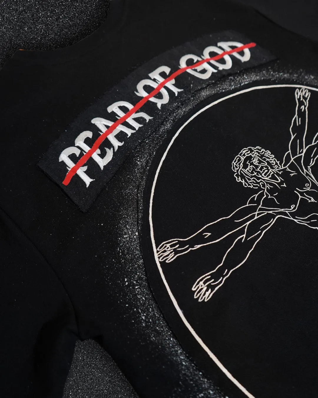 FEAR OF GOD vs VITRUVIAN MAN BLACK VALKYRE TSHIRT