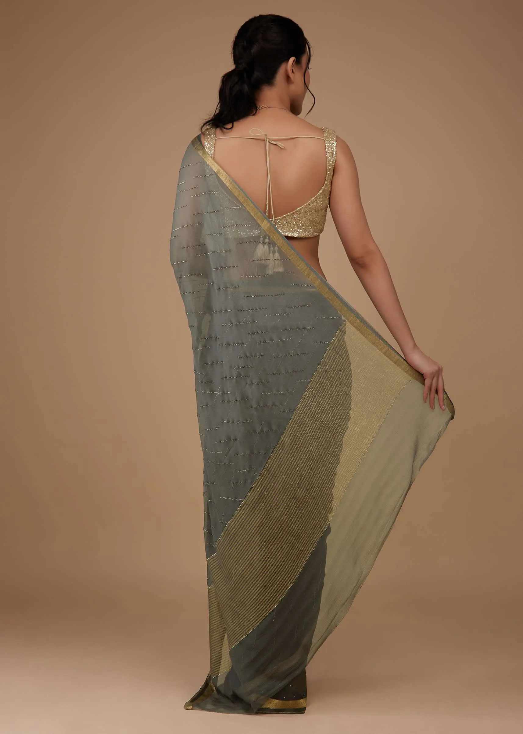 Fog Grey Chiffon Saree With Swarovski Stone Embellishments And Zari Border