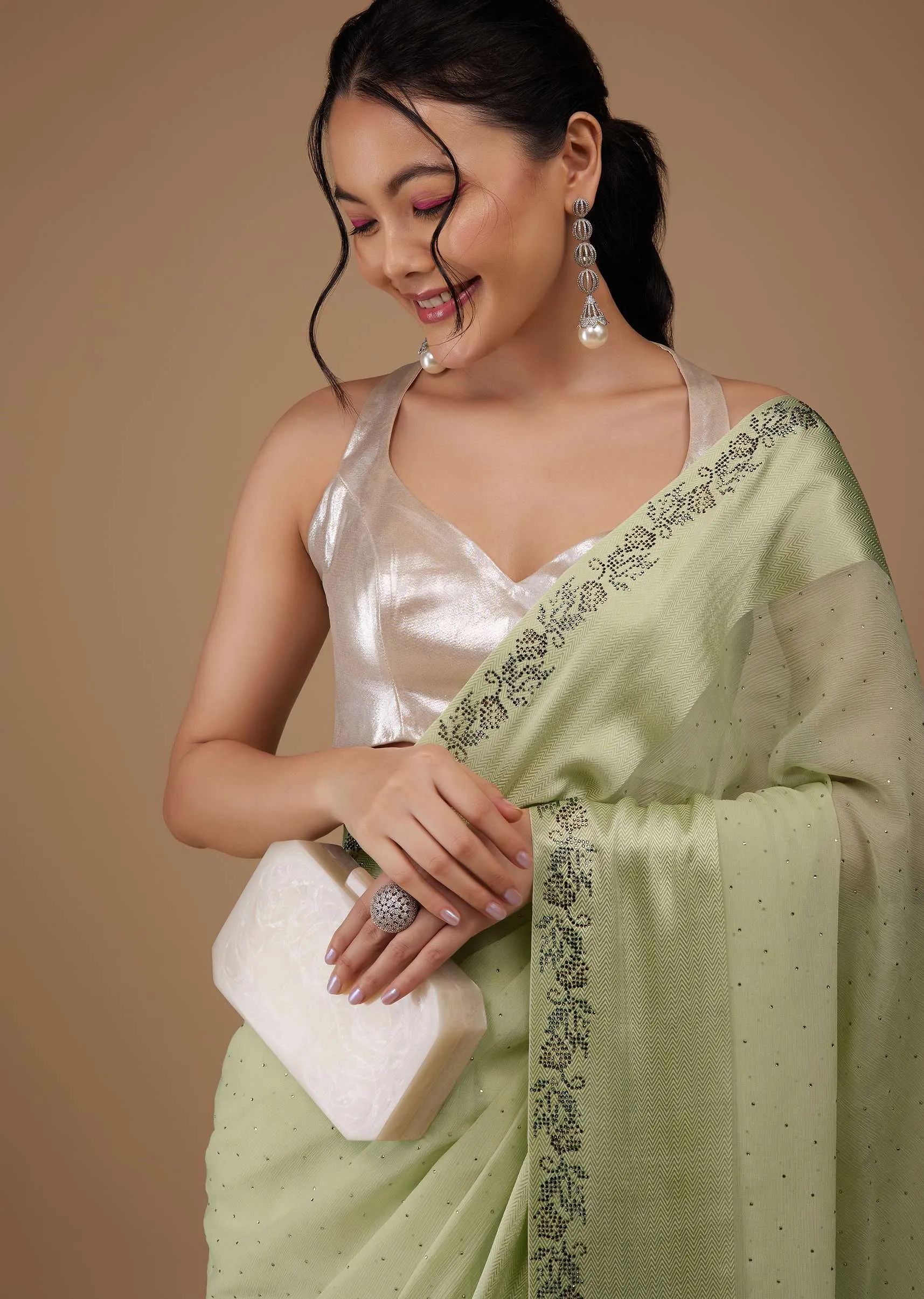 Moss Green Chiffon Saree With Stone Embellishments And Satin Border